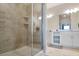 Large walk-in shower with beige tile and glass enclosure at 3171 Paradox Cir # 403, Kissimmee, FL 34746