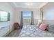 Spacious main bedroom with large bed, TV and view at 3171 Paradox Cir # 403, Kissimmee, FL 34746