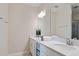 Clean bathroom with double vanity, large mirror and shower at 3171 Paradox Cir # 403, Kissimmee, FL 34746
