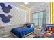 ' bedroom with twin beds, nightstands, and Mickey Mouse decor at 3171 Paradox Cir # 403, Kissimmee, FL 34746