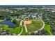 Baseball field, tennis courts, and playground in a lush, green community park at 3768 Via Mazzini Ct, Kissimmee, FL 34759