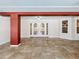 Bright covered entry with double doors and terracotta tile floor at 2376 Gunn Rd, Kissimmee, FL 34746