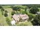 Aerial view of house on a spacious lot with a shed at 2376 Gunn Rd, Kissimmee, FL 34746