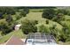 Aerial view of a home with a pool and shed in the backyard at 2376 Gunn Rd, Kissimmee, FL 34746