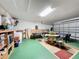 Large garage with game tables and storage at 3075 Barbados Ln, Haines City, FL 33844