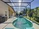 Relaxing pool area with patio and grill at 3075 Barbados Ln, Haines City, FL 33844