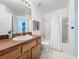 Clean bathroom with shower/tub combo and wood vanity at 3075 Barbados Ln, Haines City, FL 33844