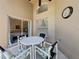 Cozy patio with table and chairs, adjacent to a bedroom at 3075 Barbados Ln, Haines City, FL 33844