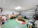 Finished garage with game tables and storage at 3075 Barbados Ln, Haines City, FL 33844