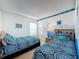 Two twin beds with ocean-themed bedding in a bright bedroom at 3075 Barbados Ln, Haines City, FL 33844