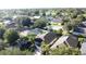 Aerial view of a residential neighborhood with houses and lush green landscaping at 3075 Barbados Ln, Haines City, FL 33844