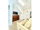 Multi-purpose bonus room with sofa and TV at 8079 Nemours Pkwy, Orlando, FL 32827