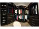 Large walk-in closet with ample hanging space and drawers at 8079 Nemours Pkwy, Orlando, FL 32827