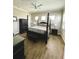 Main bedroom with king-size bed, and plenty of natural light at 8079 Nemours Pkwy, Orlando, FL 32827