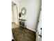 Inviting entryway showcasing a console table and mirror at 8079 Nemours Pkwy, Orlando, FL 32827