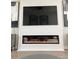 Sleek linear fireplace and mounted TV at 8079 Nemours Pkwy, Orlando, FL 32827