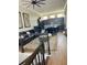 Open living area with sectional sofa and view of kitchen at 8079 Nemours Pkwy, Orlando, FL 32827