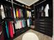 Large walk-in closet with hanging rods and drawers at 8079 Nemours Pkwy, Orlando, FL 32827