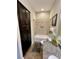 Bathroom with tub, shower, granite vanity, and linen closet at 8079 Nemours Pkwy, Orlando, FL 32827