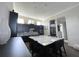 Modern kitchen with large island and stainless steel appliances at 8079 Nemours Pkwy, Orlando, FL 32827