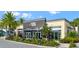 Exterior view of community fitness center with landscaping at 8079 Nemours Pkwy, Orlando, FL 32827
