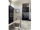 Well-equipped kitchen featuring granite counters and stainless steel sink at 8079 Nemours Pkwy, Orlando, FL 32827