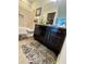 Bathroom features granite vanity and updated fixtures at 8079 Nemours Pkwy, Orlando, FL 32827