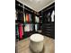 Large walk-in closet with hanging space and storage at 8079 Nemours Pkwy, Orlando, FL 32827