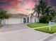 Single-Gathering home with two-car garage and landscaped front yard at 7978 Magnolia Bend Ct, Kissimmee, FL 34747