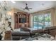 Living room with a view of the pool through sliding glass doors at 7978 Magnolia Bend Ct, Kissimmee, FL 34747