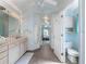 Main bathroom with double vanity and access to bedroom at 7978 Magnolia Bend Ct, Kissimmee, FL 34747