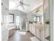 Large Primary bathroom with double vanity, soaking tub, and walk-in shower at 7978 Magnolia Bend Ct, Kissimmee, FL 34747