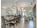 Spacious dining room with a large table and view to the living room at 7978 Magnolia Bend Ct, Kissimmee, FL 34747
