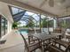 Relaxing pool area with covered patio and seating at 7978 Magnolia Bend Ct, Kissimmee, FL 34747