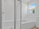 Spa-like bathroom with soaking tub and walk-in shower at 2043 Stetson Ct, Eagle Lake, FL 33839