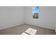 Bright bedroom with neutral carpet and large window at 2043 Stetson Ct, Eagle Lake, FL 33839