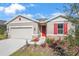 New construction home with red shutters and stone accents at 2043 Stetson Ct, Eagle Lake, FL 33839