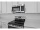 Stainless steel appliances in a modern kitchen at 2043 Stetson Ct, Eagle Lake, FL 33839