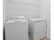 Laundry room with washer, dryer and overhead shelving at 2043 Stetson Ct, Eagle Lake, FL 33839