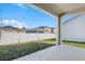 Covered patio overlooking backyard and neighboring homes at 2043 Stetson Ct, Eagle Lake, FL 33839