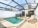 Private screened pool and spa with safety fence at 8971 Stinger Dr, Davenport, FL 33896