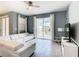 Living room with white sectional sofa and access to backyard patio at 8971 Stinger Dr, Davenport, FL 33896