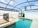 Private screened pool and spa with safety fence at 8971 Stinger Dr, Davenport, FL 33896