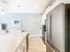 Sleek kitchen island with quartz countertops and stainless steel appliances at 8971 Stinger Dr, Davenport, FL 33896