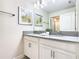 Modern bathroom with double vanity and gray countertop at 8971 Stinger Dr, Davenport, FL 33896