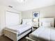 Spacious bedroom with two beds and ample closet space at 8971 Stinger Dr, Davenport, FL 33896