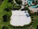 Beach volleyball court with lines and surrounding greenery at 8971 Stinger Dr, Davenport, FL 33896