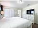 Spacious bedroom with a king-size bed and ensuite bathroom at 8971 Stinger Dr, Davenport, FL 33896