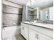 Bathroom with double vanity, bathtub, and shower at 8971 Stinger Dr, Davenport, FL 33896