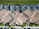 Aerial view of community, showcasing tile roofs and pools at 8971 Stinger Dr, Davenport, FL 33896
